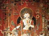 Tibet Guge 03 Tholing 08 White Temple 03 Padmapani On the left wall is a painting of Padmapani (Lotus-Bearer), one of oldest forms of Avalokiteshvara, the Bodhisattva of Infinite Compassion. The right hand makes the gesture of giving while the left signifies teaching. Padmapani is identified by the lotus flower above his left shoulder, with the stem held in his left hand. Photo - Hein/Boelmann: Tibet  Der Weie Tempel von Tholing.